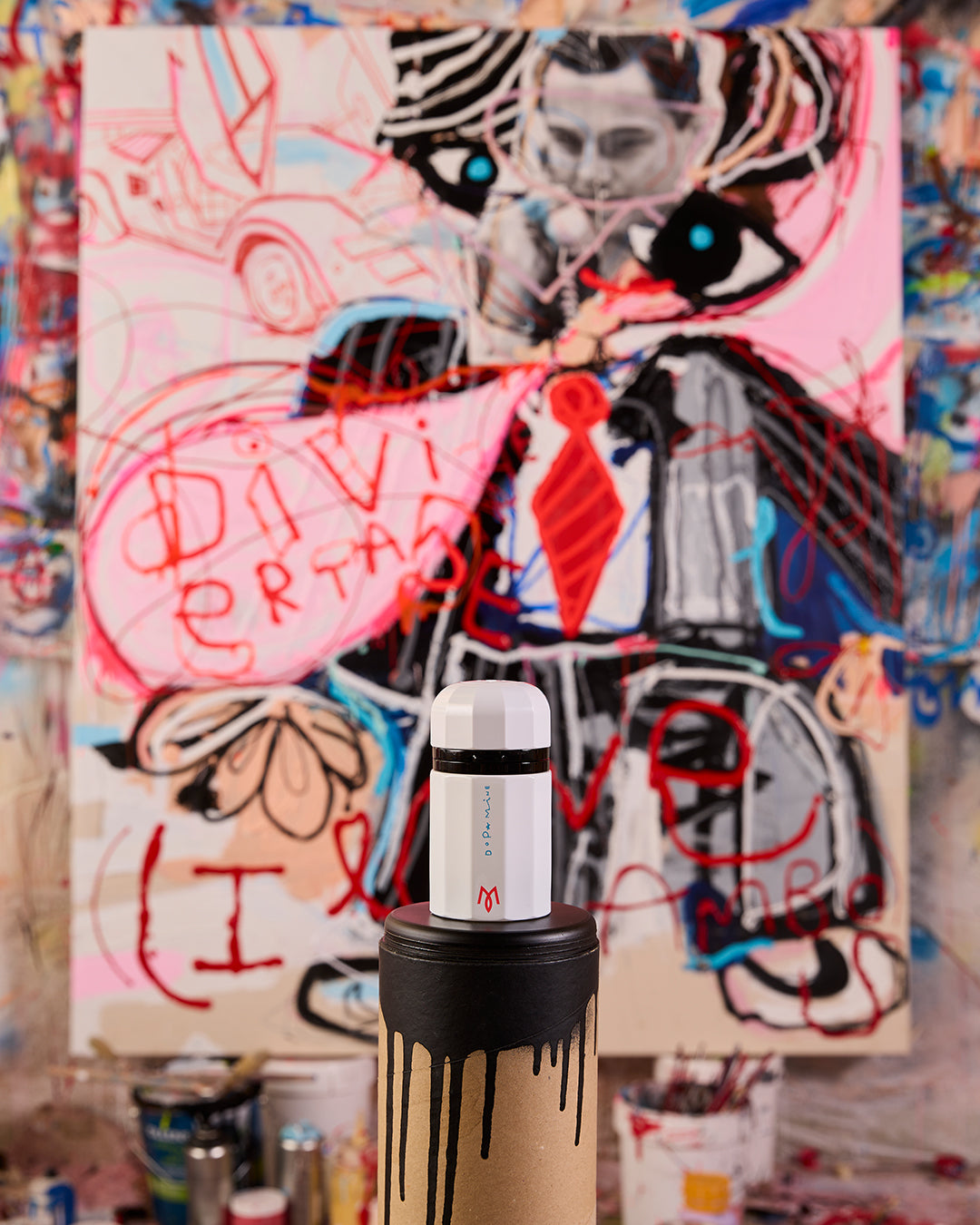 Dopamine bottle in Miguel Caravaca's studio in front of an original painting