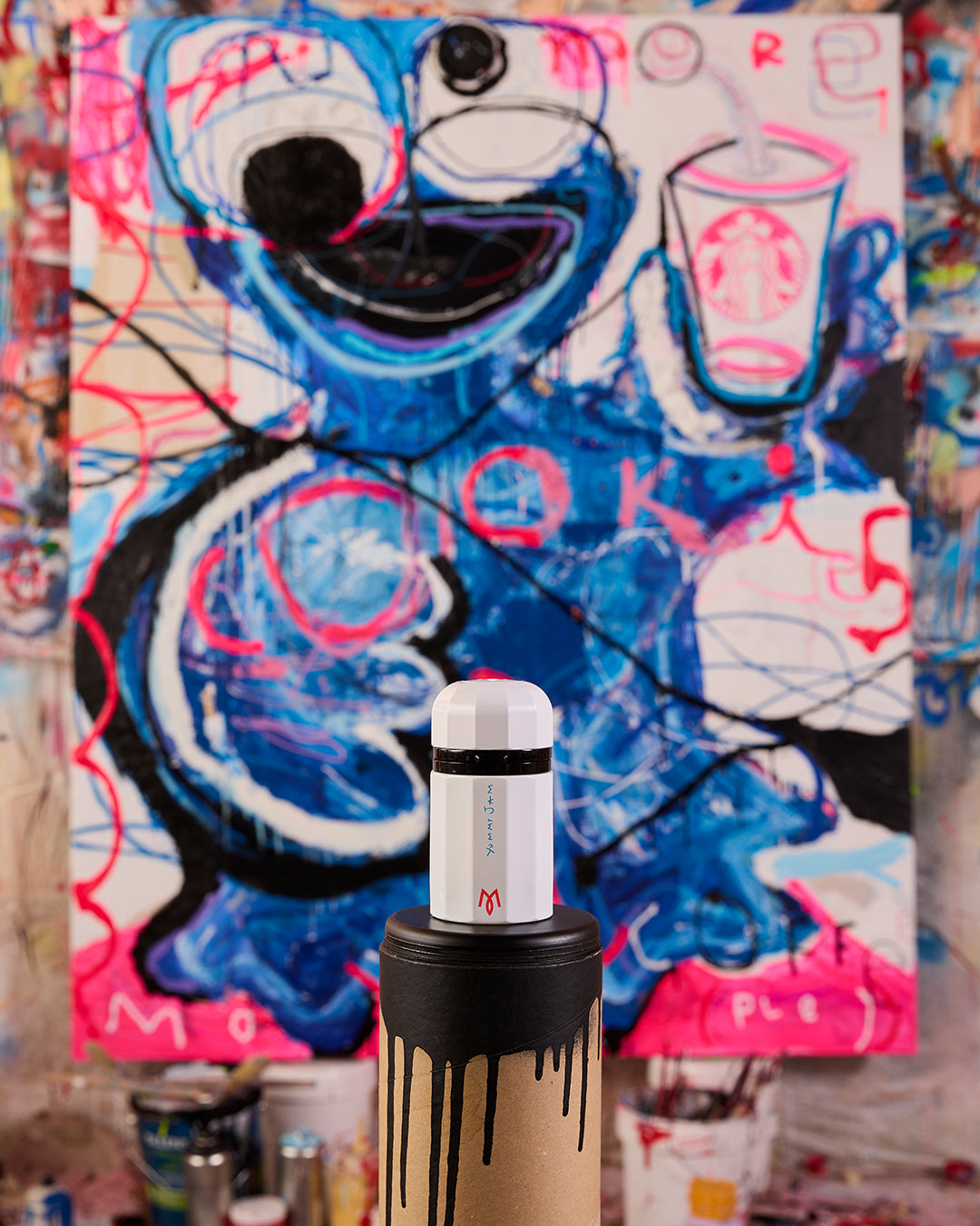 Yummy Jam bottle in Miguel Caravaca's studio in front of the Cookie Monster painting